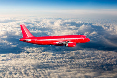 Red plane clouds jet group travel